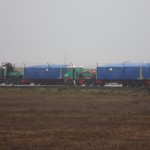 Two TF Coils are waiting in transport boxes for loading into the airplane