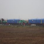 Two TF Coils are waiting in transport boxes for loading into the airplane