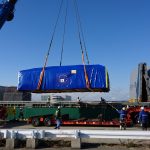 Lifting the transport boxes in the vessel in the harbour of Nagoya airport